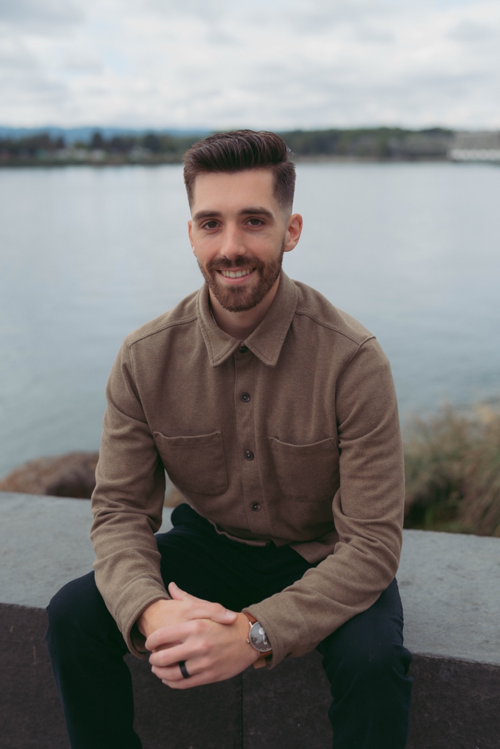 Kasey Ingram, founder of Greatest Goal, seated beside the water